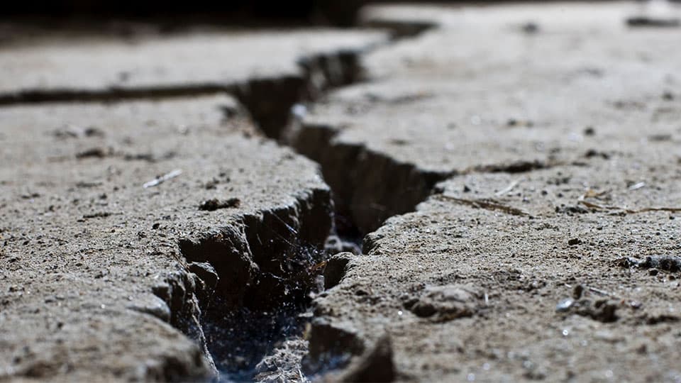 A crack formed in the middle of a concrete road
